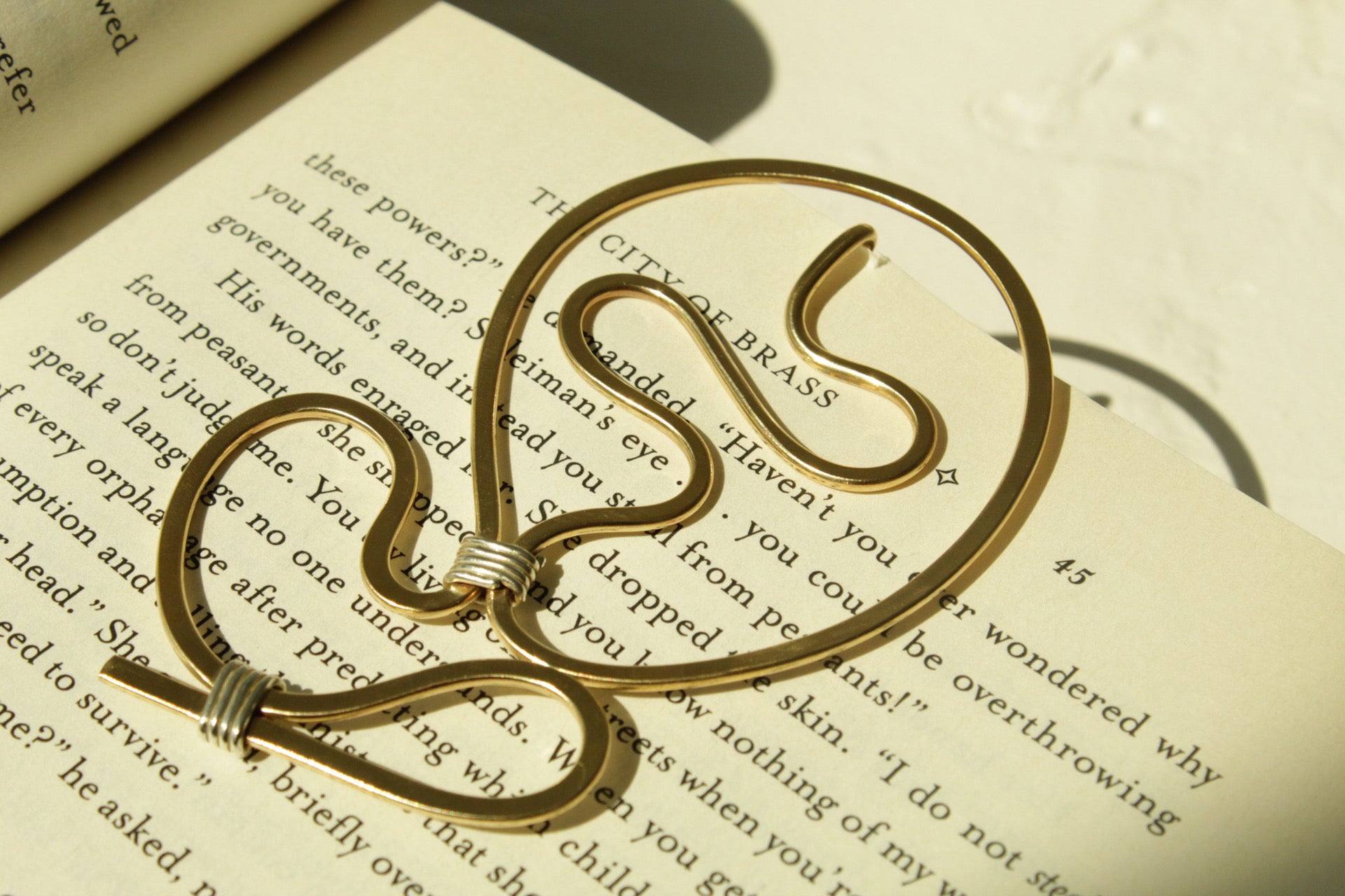Held between Pages.
